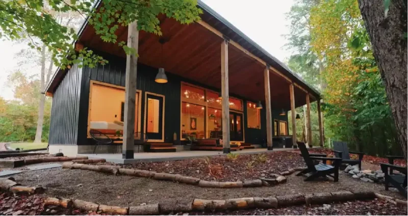 The Ren is a modern 850‑sq‑ft cabin tucked deep in the Hocking Hills woods, offering two bedrooms, two bathrooms, a hot tub, and a peaceful private setting. This cozy Ohio cabin blends sleek design with natural beauty and sits close to popular Hocking Hills trails and attractions.